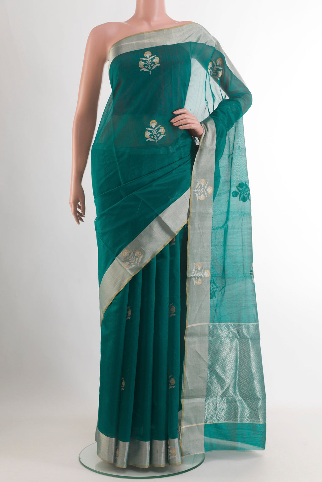 Green Chanderi Silk Saree with Zari Butta on the body and Zari Border.  displayed on a mannequin