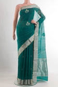 Green Chanderi Silk Saree with Zari Butta on the body and Zari Border.  displayed on a mannequin