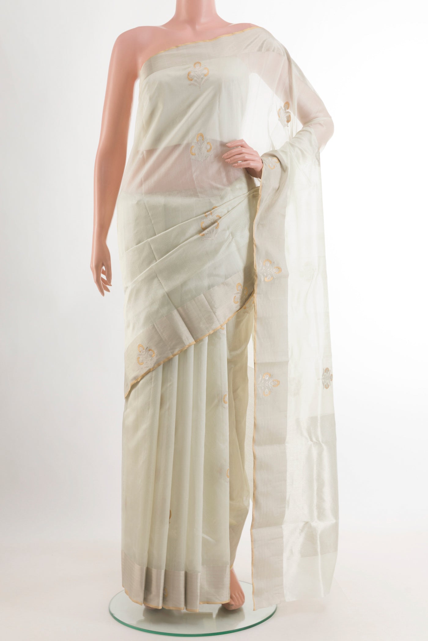 Off White Chanderi Silk Saree with Zari Butta on the body and Zari Border.  displayed on a mannequin