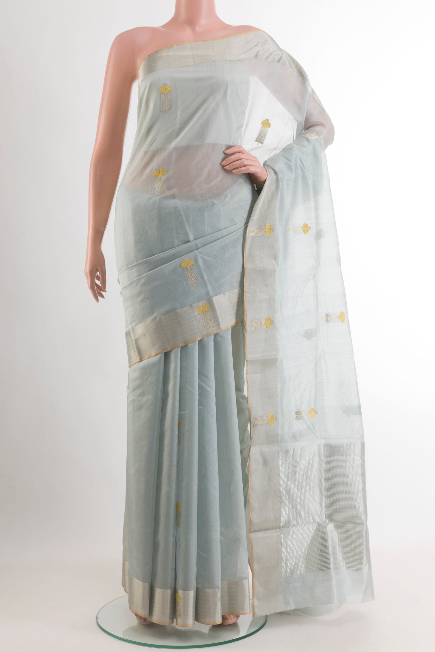 Grey Chanderi Silk Saree with Zari Butta on the body and Zari Border.  displayed on a mannequin