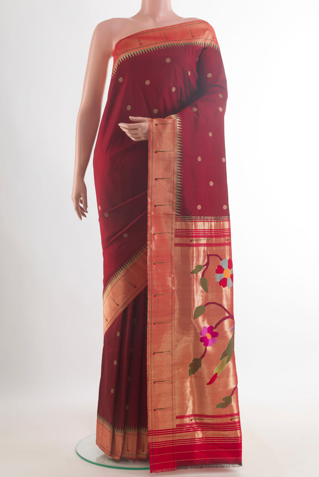 Pure Silk Maroon Paithani Saree with Zari Butta on the body and Paithani Border.  displayed on a mannequin