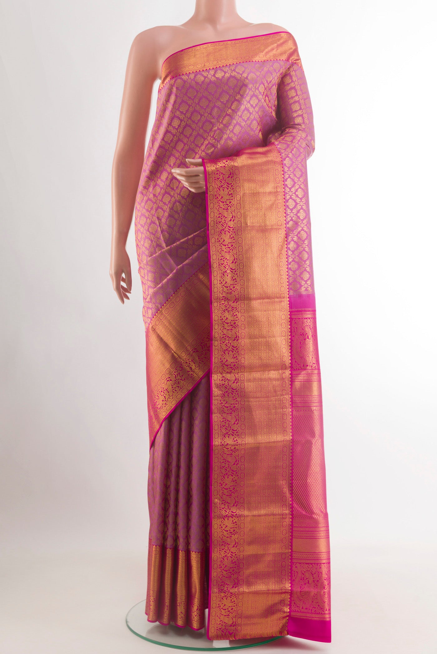 Lavender Kanchipuram Silk Saree with Zari Brocade on the body and Zari Border.  displayed on a mannequin
