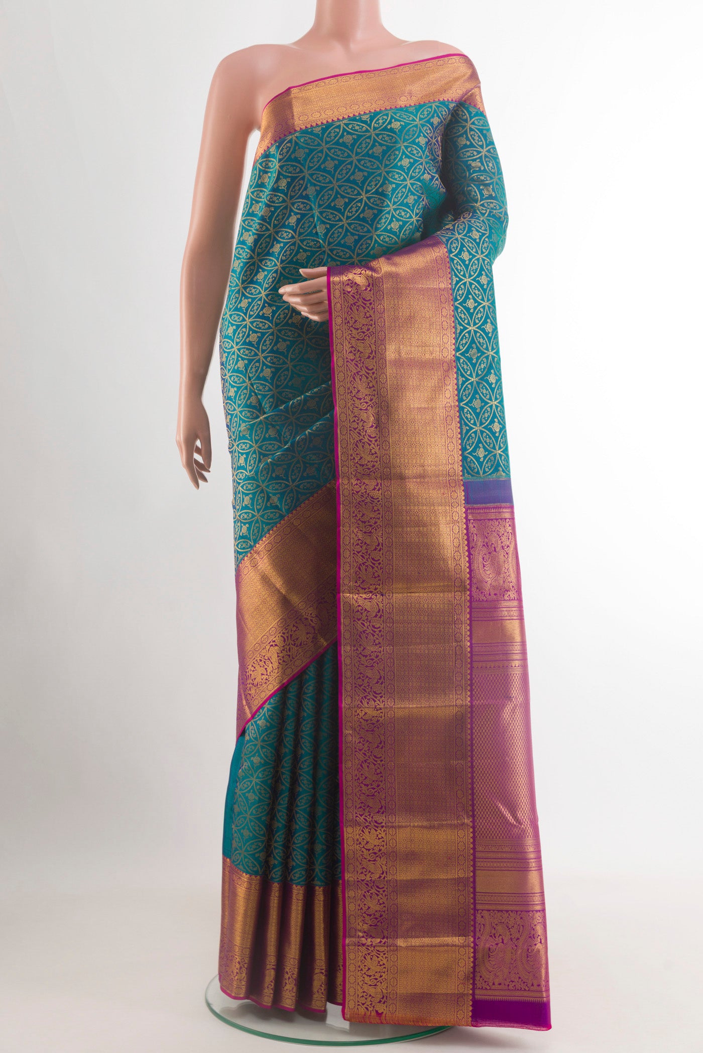 Peacock Blue Kanchipuram Silk Saree with Zari Brocade on the body and Zari Border.  displayed on a mannequin