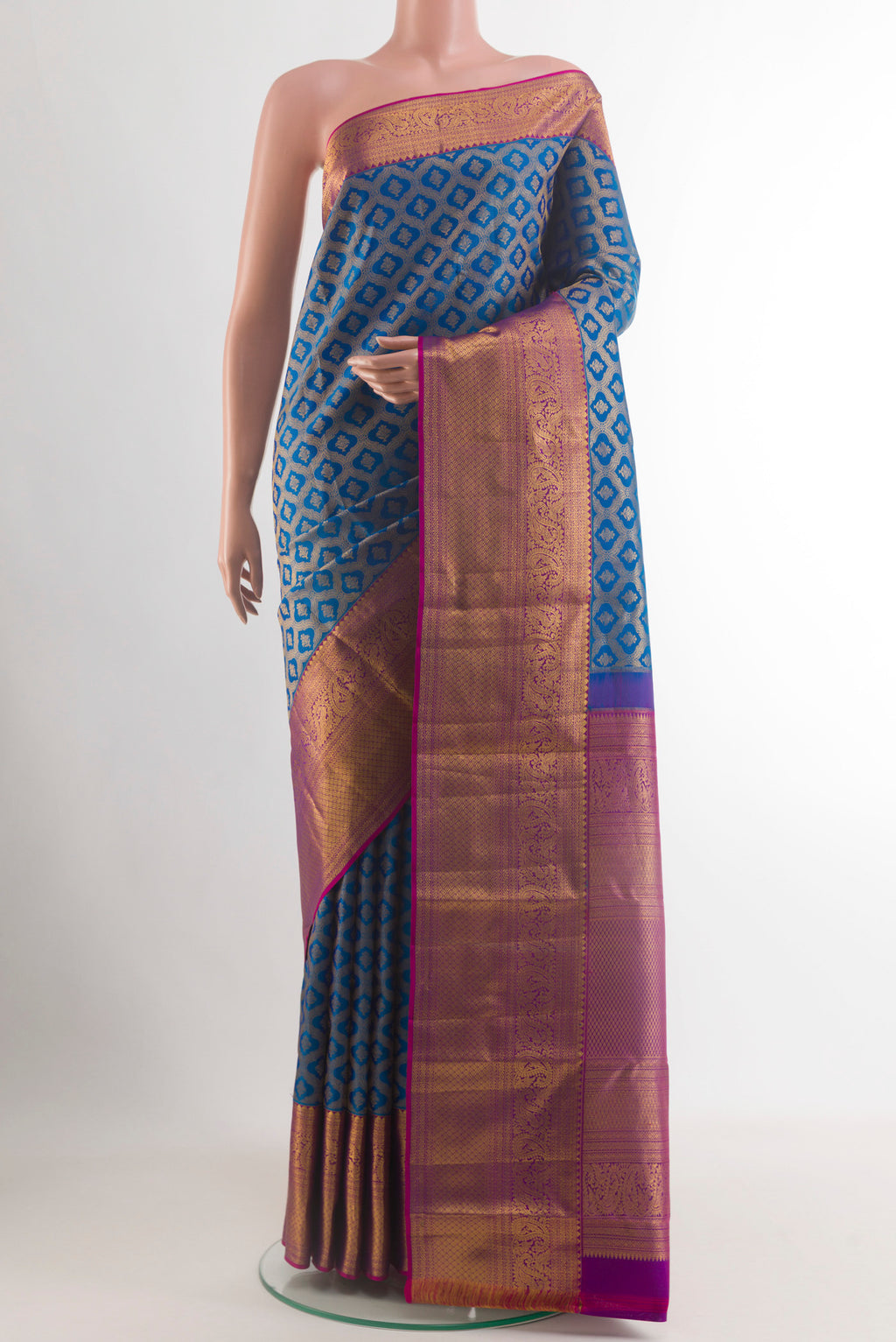 Blue Kanchipuram Silk Saree with Zari Brocade on the body and Zari Border.  displayed on a mannequin