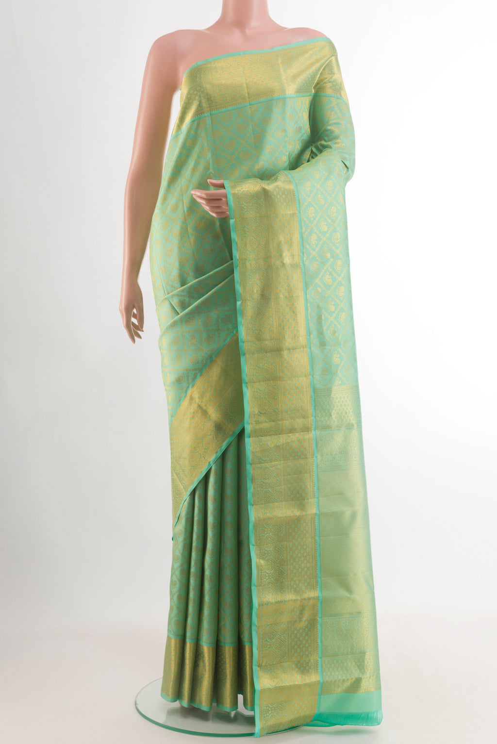 Mint Green Kanjivaram Silk Saree with Zari Brocade on the body and Zari Border.  displayed on a mannequin