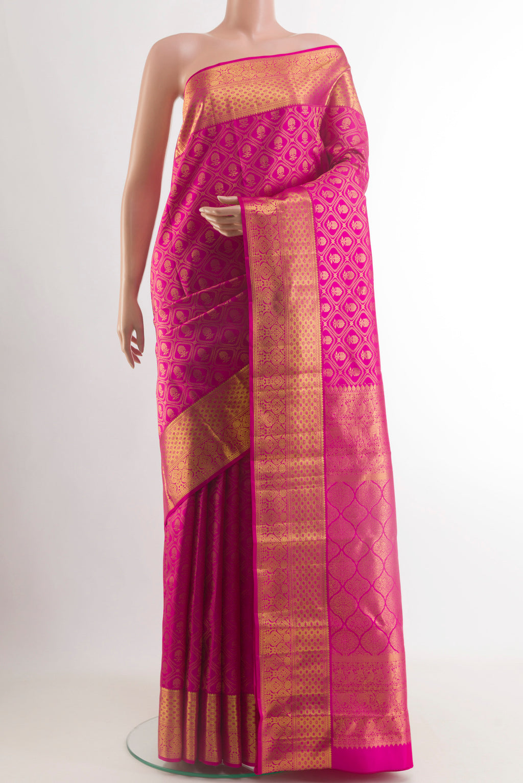 Pink Kanjivaram Silk Saree with Zari Brocade on the body and Zari Border.  displayed on a mannequin