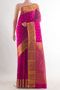 Pure Silk Dark Pink Kanjivaram Saree with Zari Butta on the body and Zari Border.  displayed on a mannequin