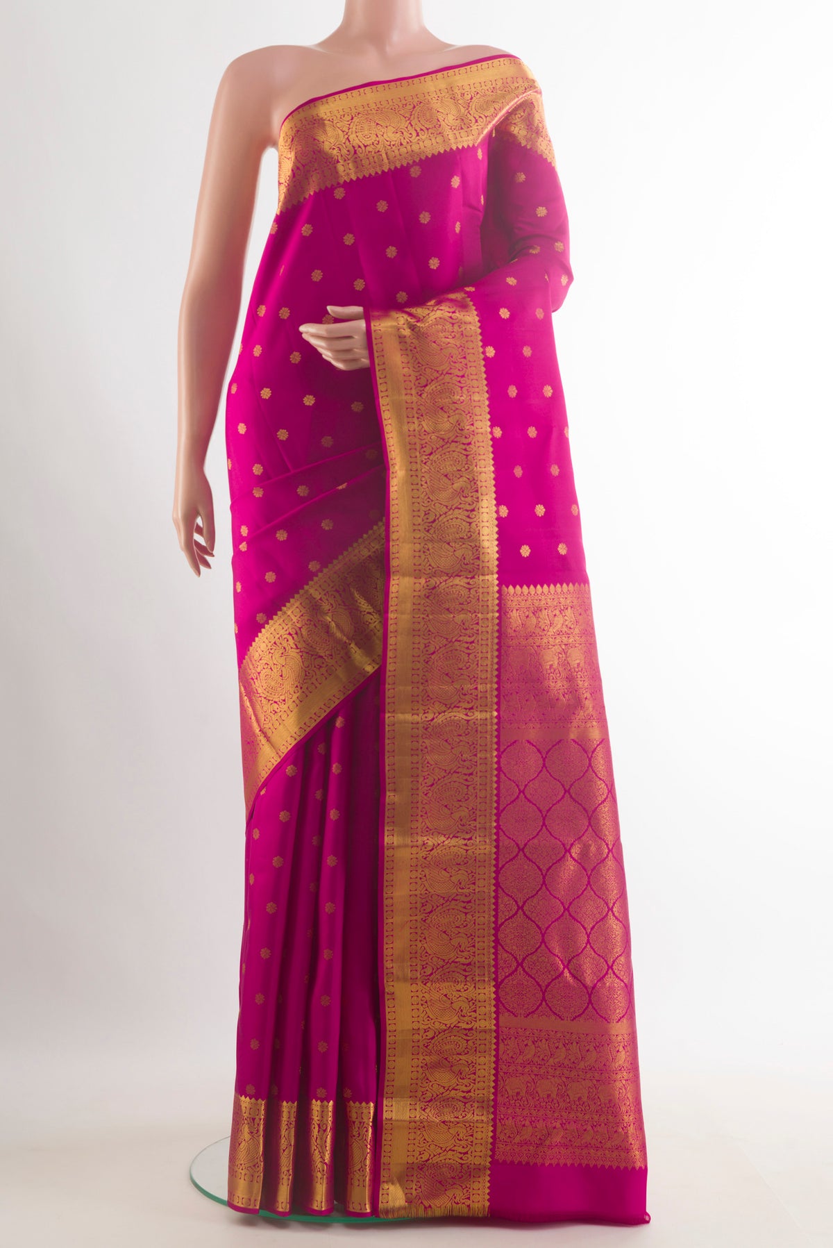 Pure Silk Dark Pink Kanjivaram Saree with Zari Butta on the body and Zari Border.  displayed on a mannequin