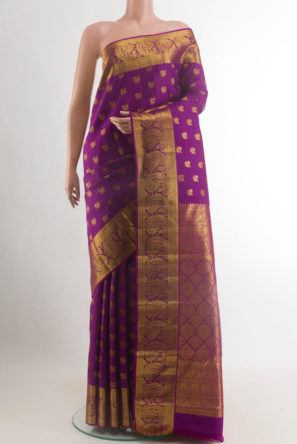 Purple Kanjivaram Silk Saree with Zari Butta on the body and Zari Border.  displayed on a mannequin