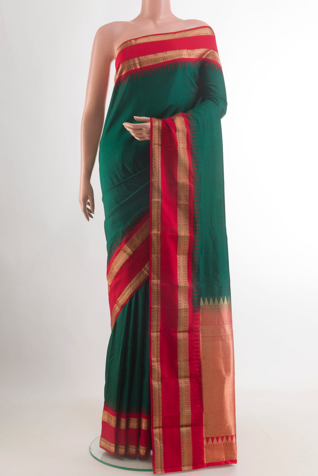Bottle Green Bangalore Silk Saree with Plain Body and Zari Border.  displayed on a mannequin