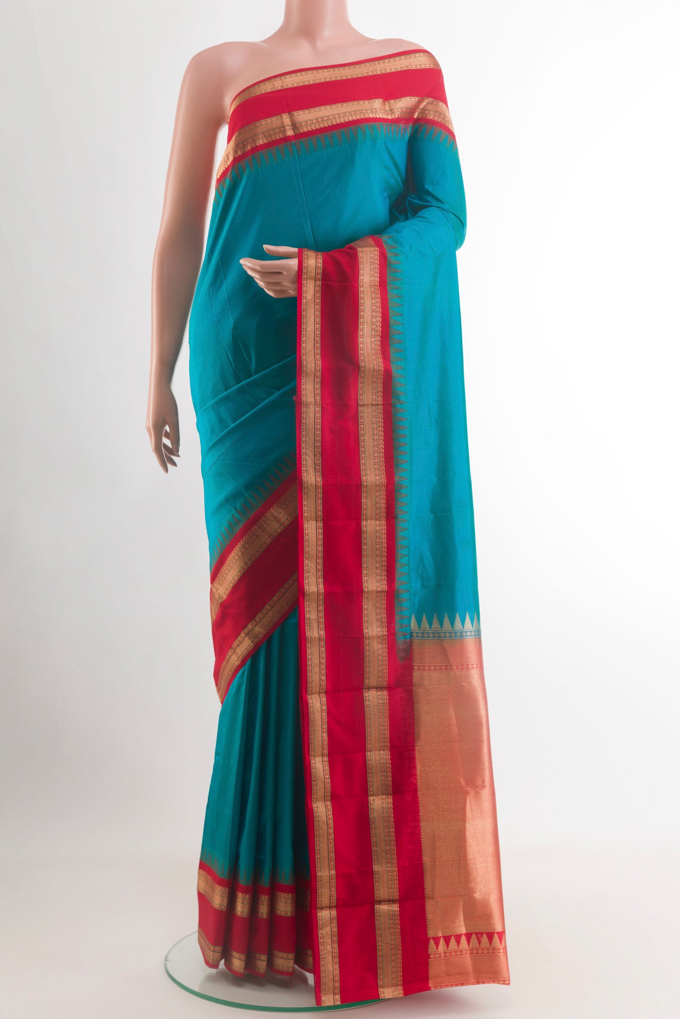 Blue Bangalore Silk Saree with Plain Body and Zari Border.  displayed on a mannequin