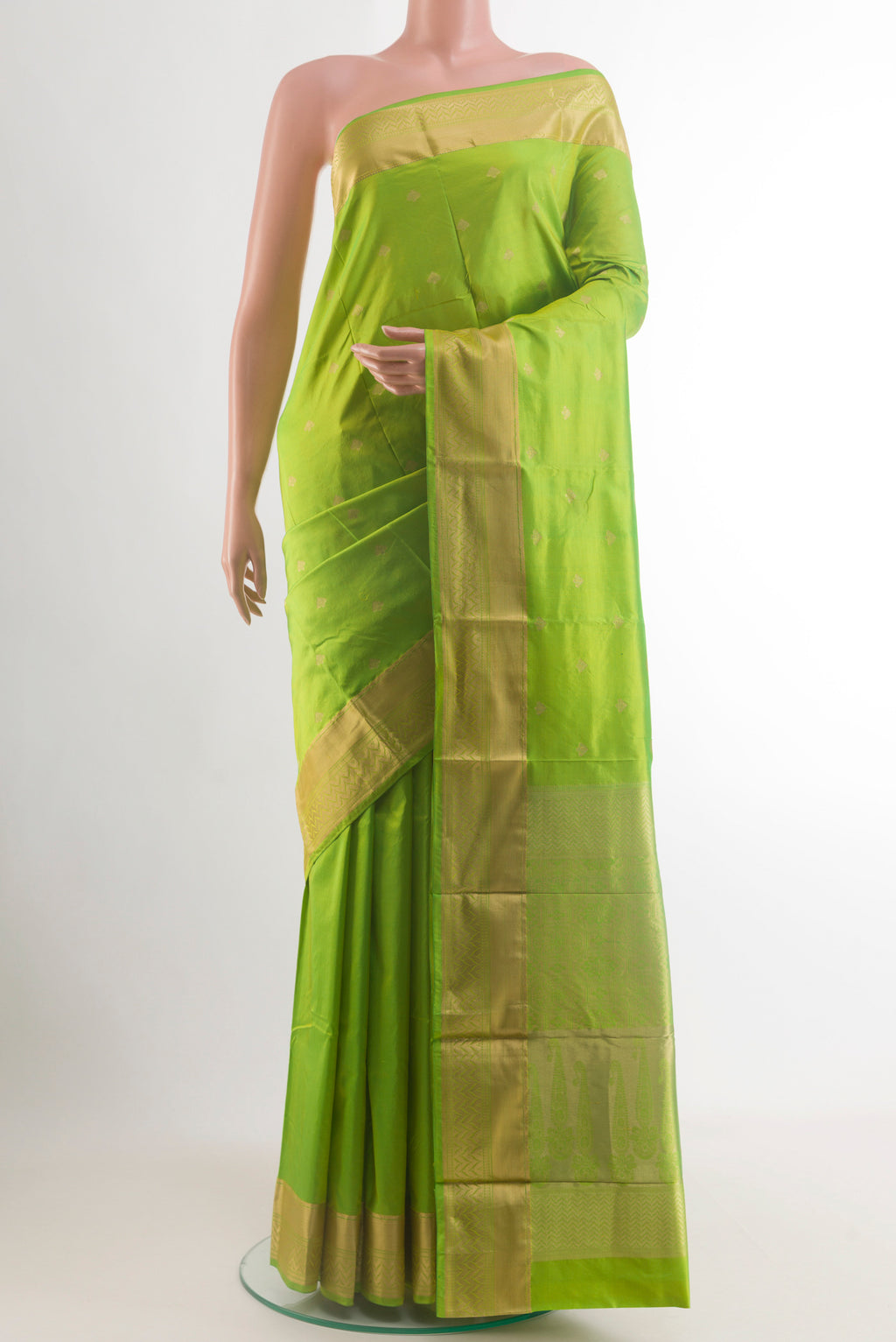 Parrot Green Bangalore Silk Saree with Zari Butta on the body and Zari Border.  displayed on a mannequin