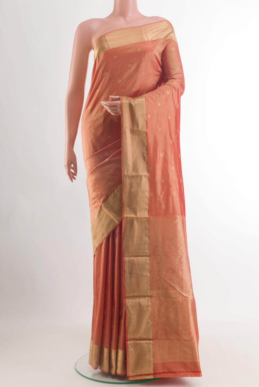 Peach Bangalore Silk Saree with Zari Butta on the body and Zari Border.  displayed on a mannequin