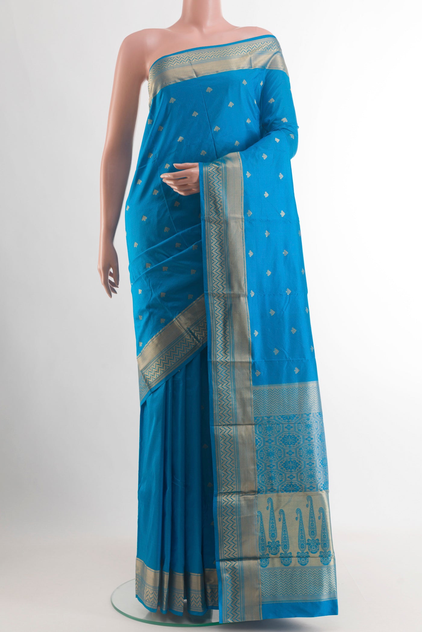 Blue Bangalore Silk Saree with Zari Butta on the body and Zari Border.  displayed on a mannequin