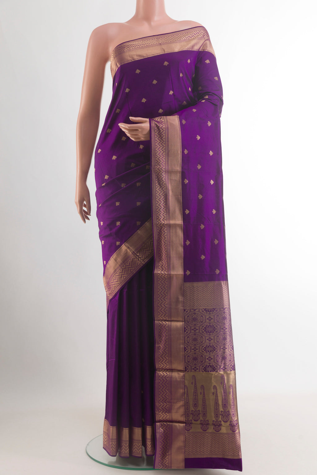 Violet Kanjivaram Silk Saree with Zari Butta on the body and Zari Border.  displayed on a mannequin
