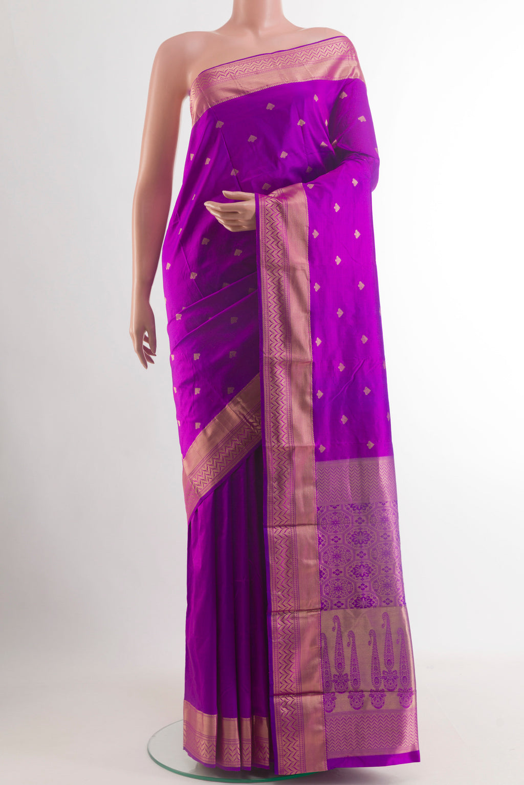 Purple Kanjivaram Silk Saree with Zari Butta on the body and Zari Border.  displayed on a mannequin