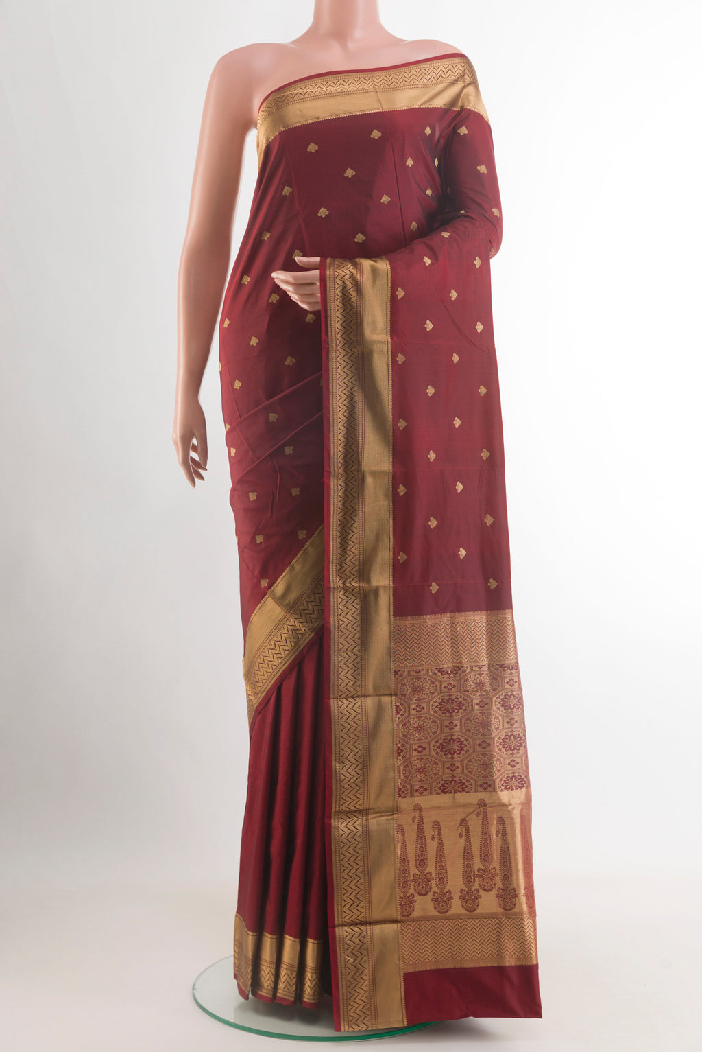 Maroon Bangalore Silk Saree with Zari Butta on the body and Zari Border.  displayed on a mannequin