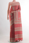 Rust Tussar Silk Saree with Printed design on the body and Printed Border.  displayed on a mannequin