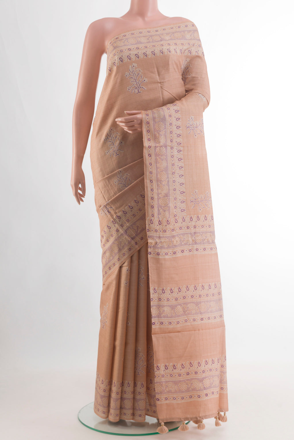 Beige Tussar Silk Saree with Printed design on the body and Printed Border.  displayed on a mannequin