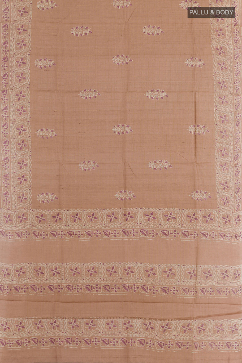 Flat view of Rose Gold Tussar Saree with Printed design on the body and Zari Border. 
