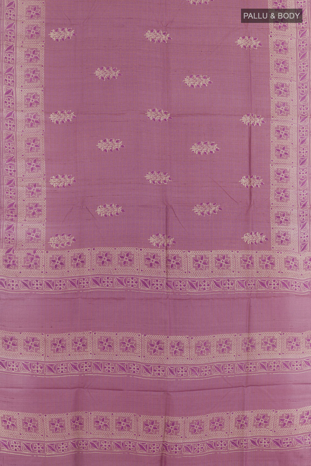 Flat view of Lavender Tussar Saree with Printed design on the body and Zari Border. 