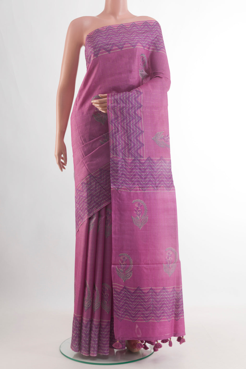 Pink Tussar Silk Saree with Printed design on the body and Printed Border.  displayed on a mannequin