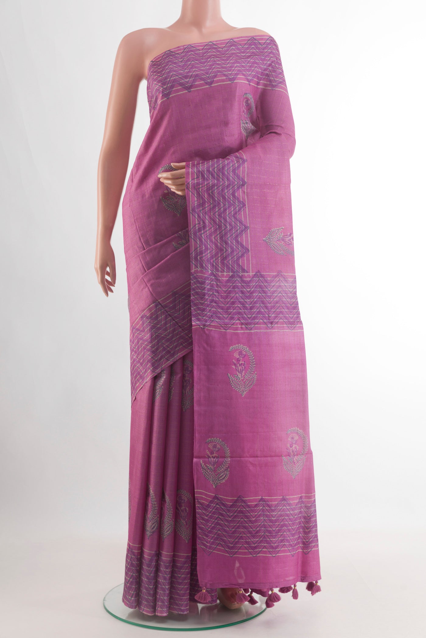 Pink Tussar Silk Saree with Printed design on the body and Printed Border.  displayed on a mannequin
