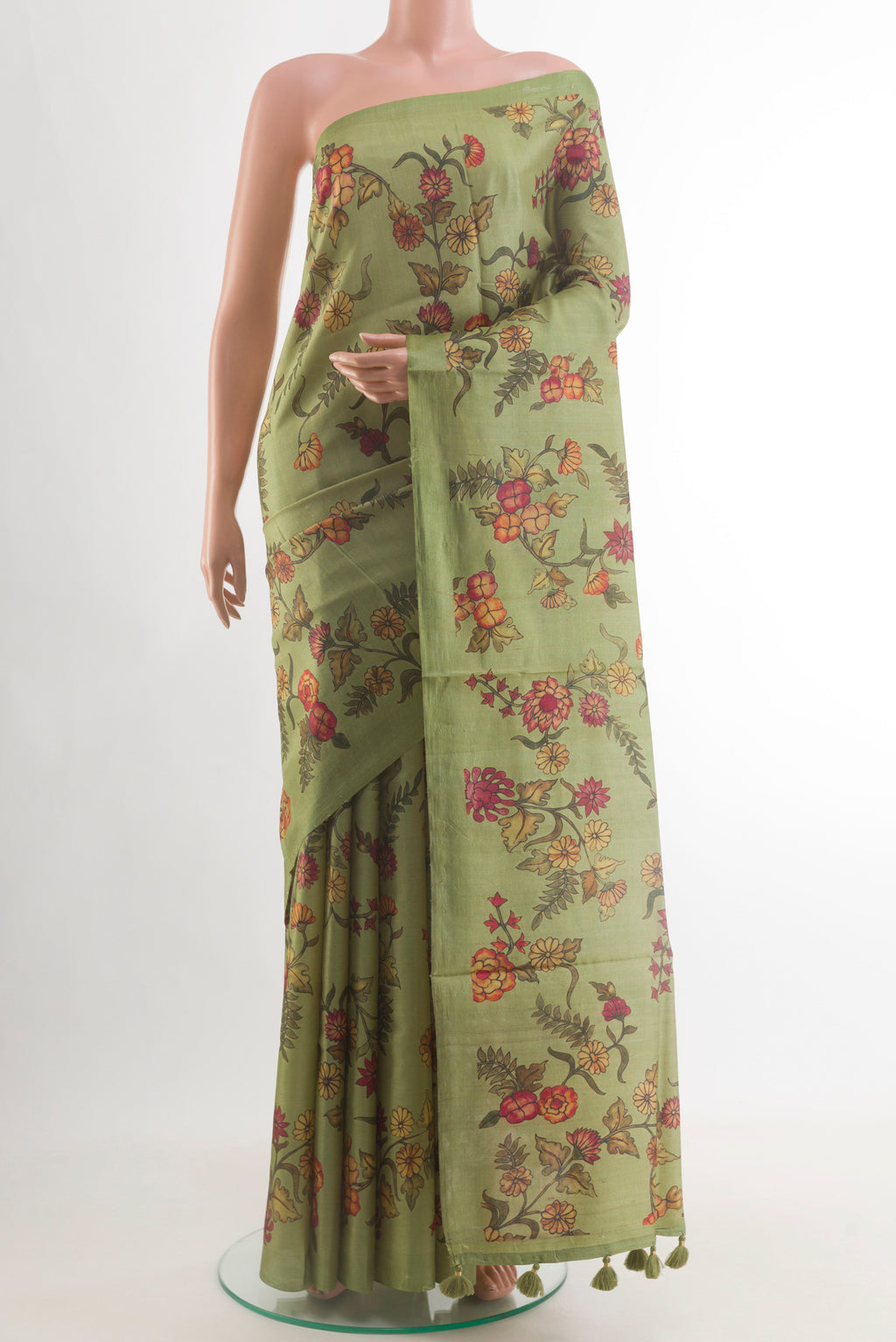 Green Tussar Silk Saree with Printed design on the body and Without Border.  displayed on a mannequin