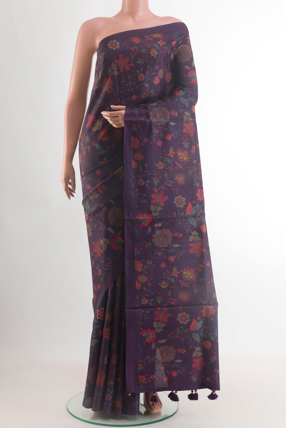 Purple Tussar Silk Saree with Floral Print on the body and Without Border.  displayed on a mannequin
