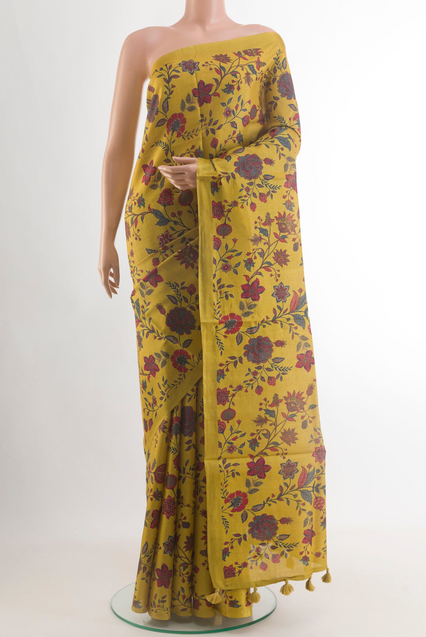 Yellow Tussar Silk Saree with Floral Print on the body and Without Border.  displayed on a mannequin