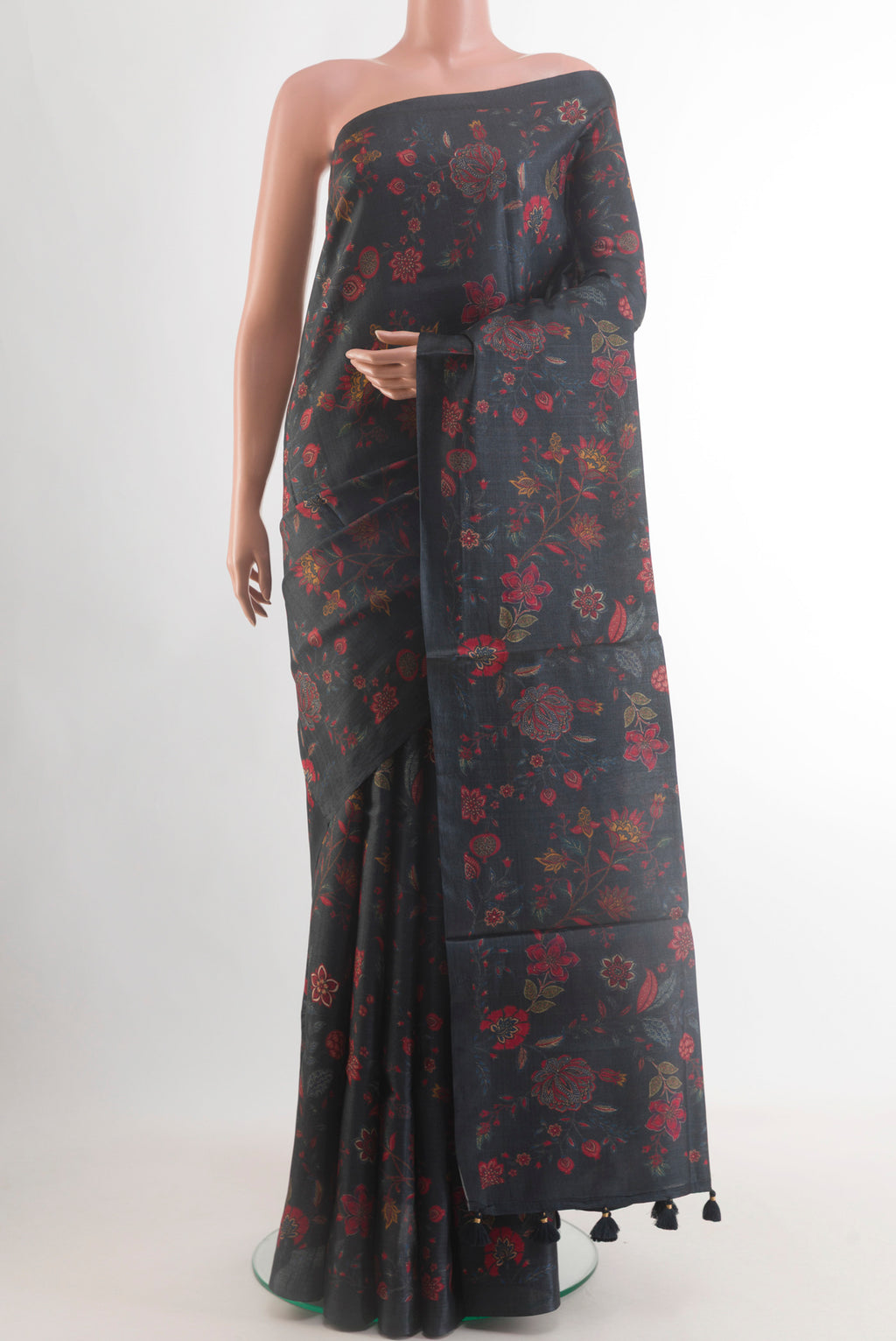 Black Tussar Saree with Floral Print on the body and Without Border.  displayed on a mannequin