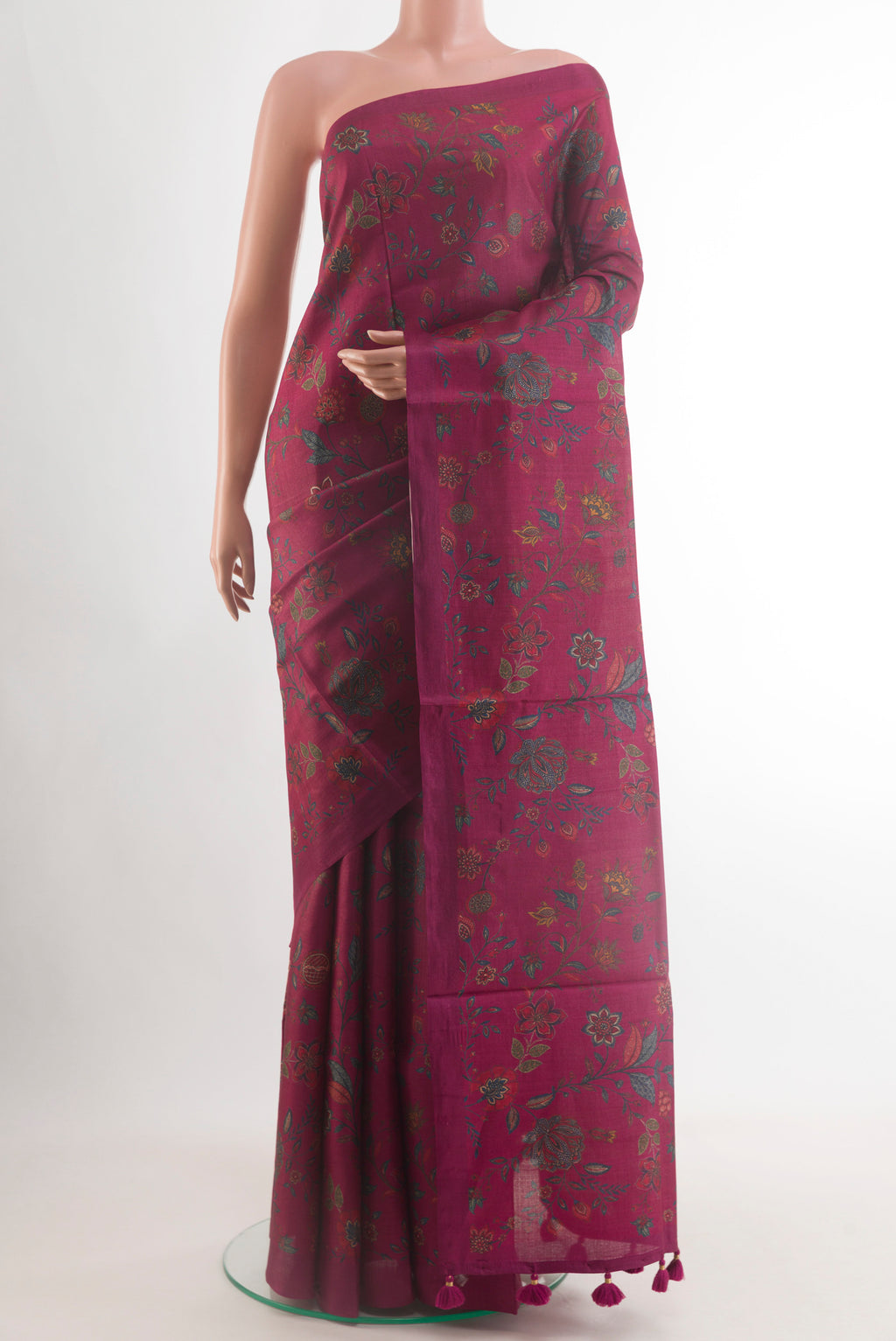 Maroon Tussar Silk Saree with Floral Print on the body and Without Border.  displayed on a mannequin
