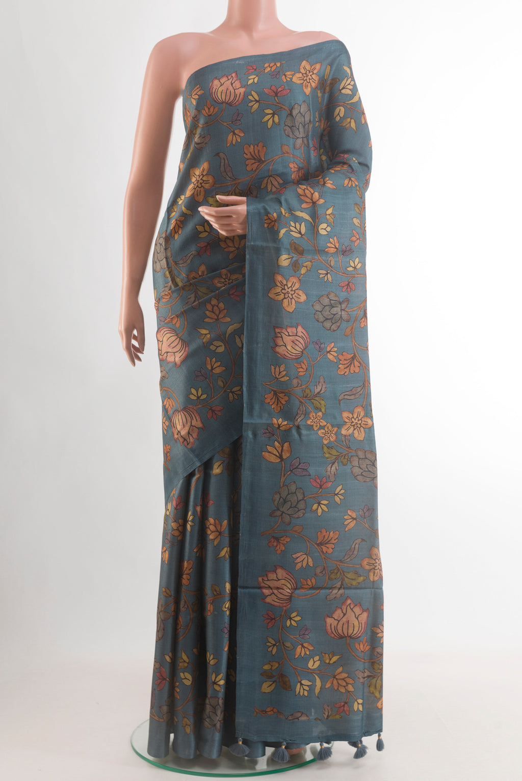 Blue Grey Tussar Silk Saree with Floral Print on the body and Without Border.  displayed on a mannequin