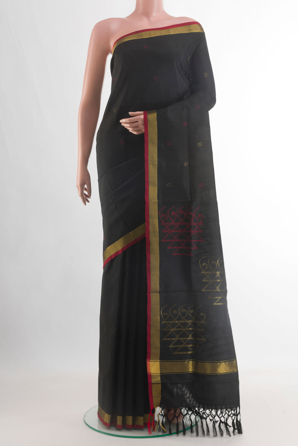 Black Uppada Silk Saree with Zari Butta on the body and Zari Border.  displayed on a mannequin