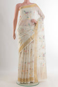 Pure Silk Pure Zari White Uppada Cotton Saree with Zari Butta on the body and Zari Border.  displayed on a mannequin
