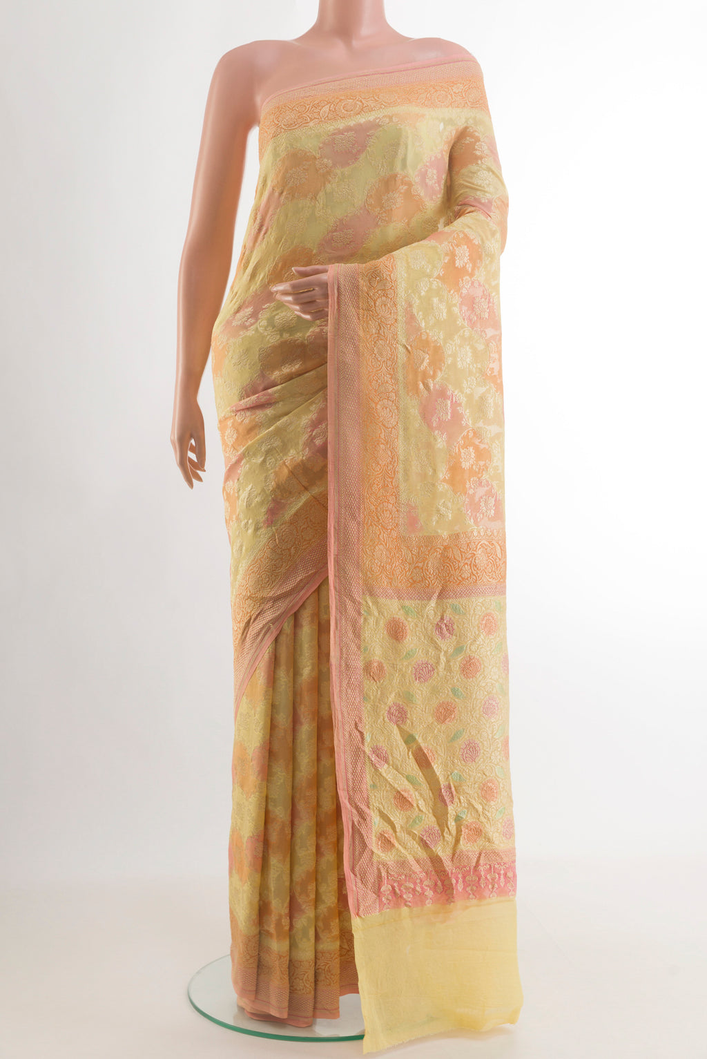 Yellow Banarasi Georgette Saree with Zari Brocade on the body and Zari Border.  displayed on a mannequin