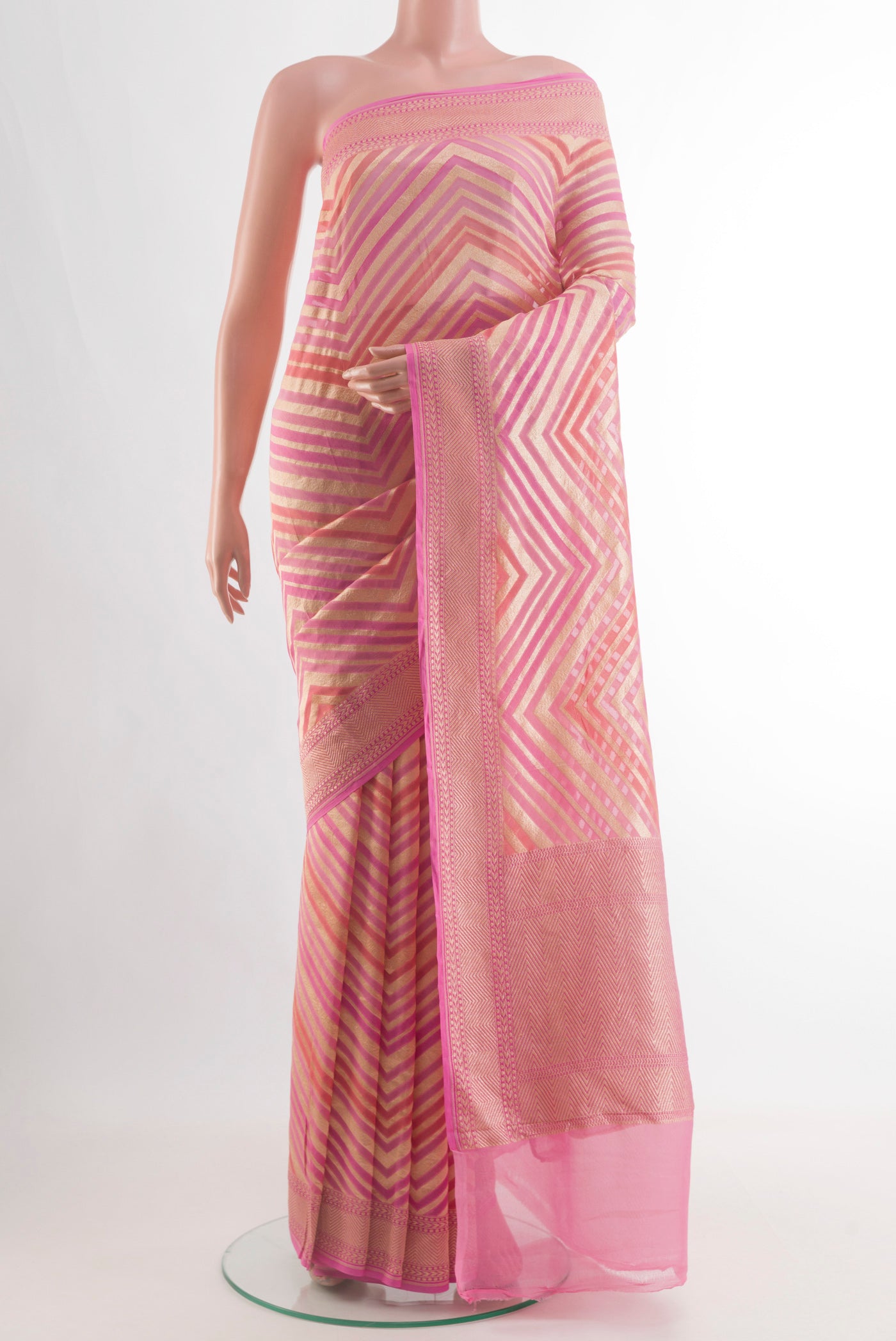 Pink Banarasi Georgette Saree with Zari Brocade on the body and Zari Border.  displayed on a mannequin
