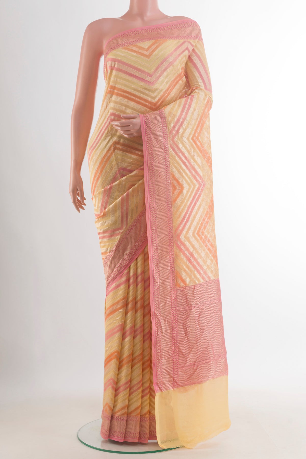 Yellow Banarasi Georgette Saree with Zari Brocade on the body and Zari Border.  displayed on a mannequin
