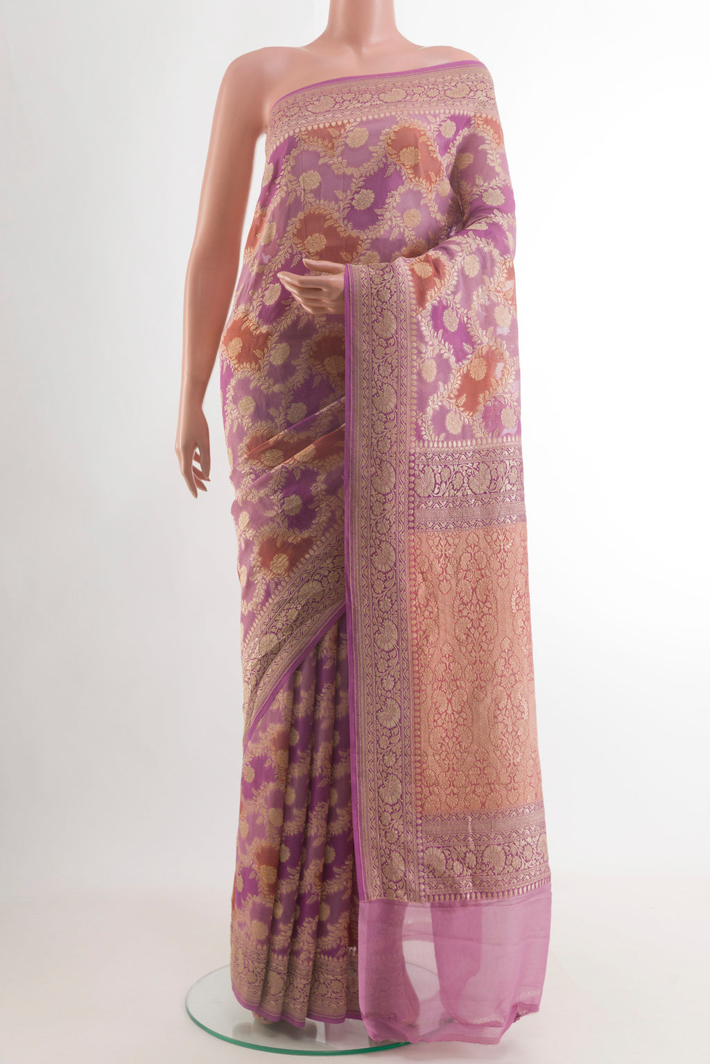 Lavender Banarasi Georgette Saree with Zari Butta on the body and Zari Border.  displayed on a mannequin