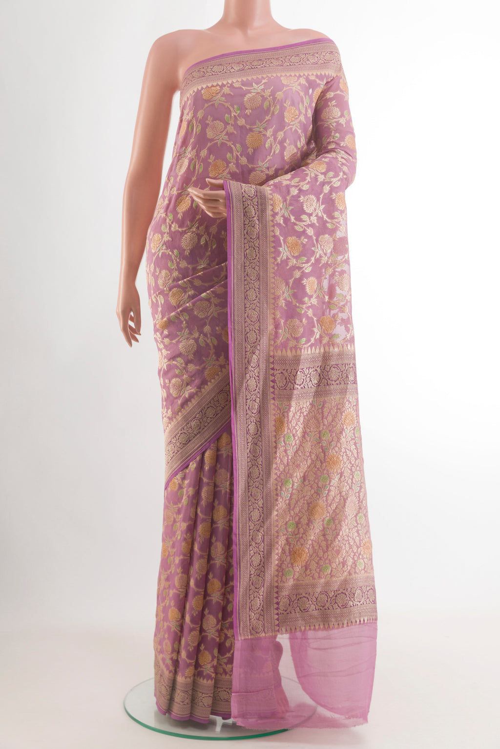 Lavender Banarasi Georgette Saree with Zari Brocade on the body and Zari Border.  displayed on a mannequin