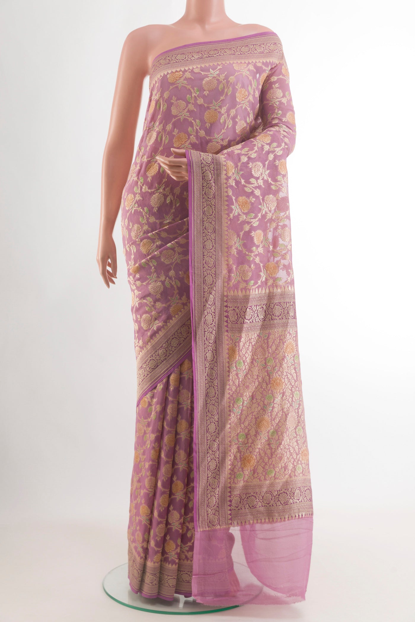 Lavender Banarasi Georgette Saree with Zari Brocade on the body and Zari Border.  displayed on a mannequin