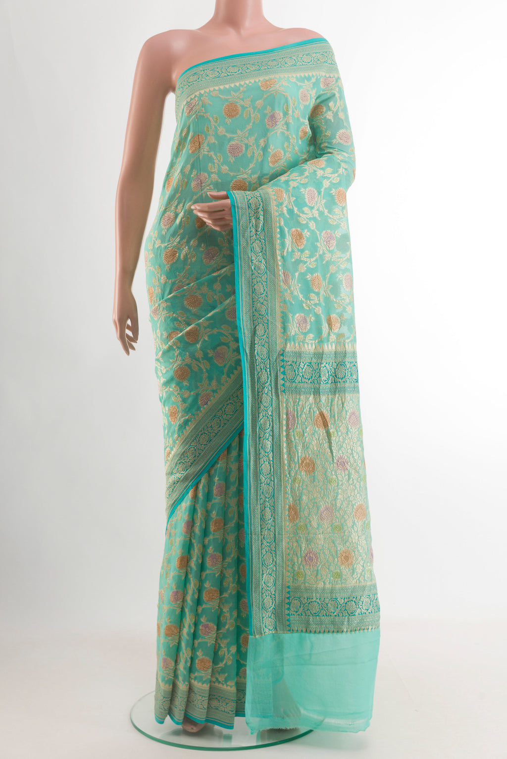 Turquoise Banarasi Georgette Saree with Zari Brocade on the body and Zari Border.  displayed on a mannequin