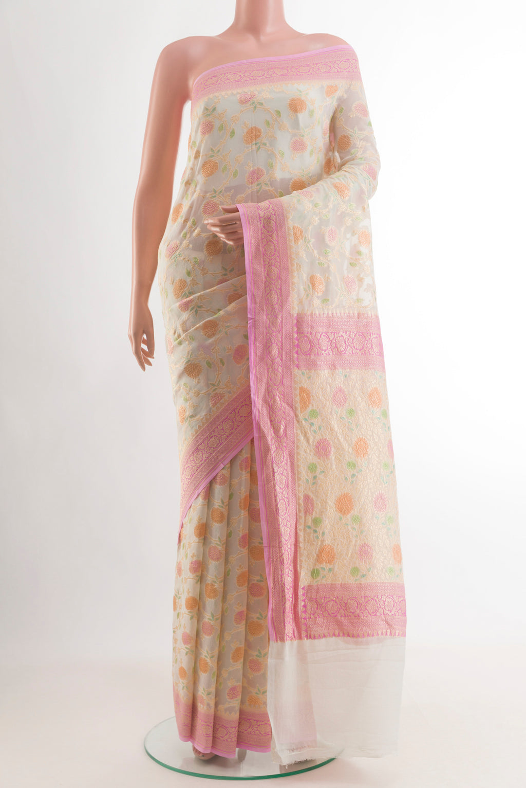 Off White Banarasi Georgette Saree with Zari Brocade on the body and Zari Border.  displayed on a mannequin