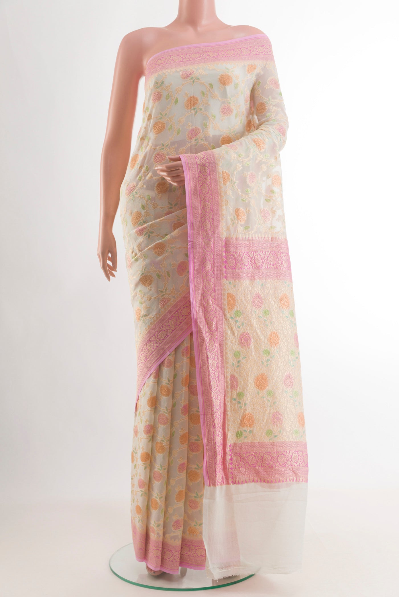 Off White Banarasi Georgette Saree with Zari Brocade on the body and Zari Border.  displayed on a mannequin