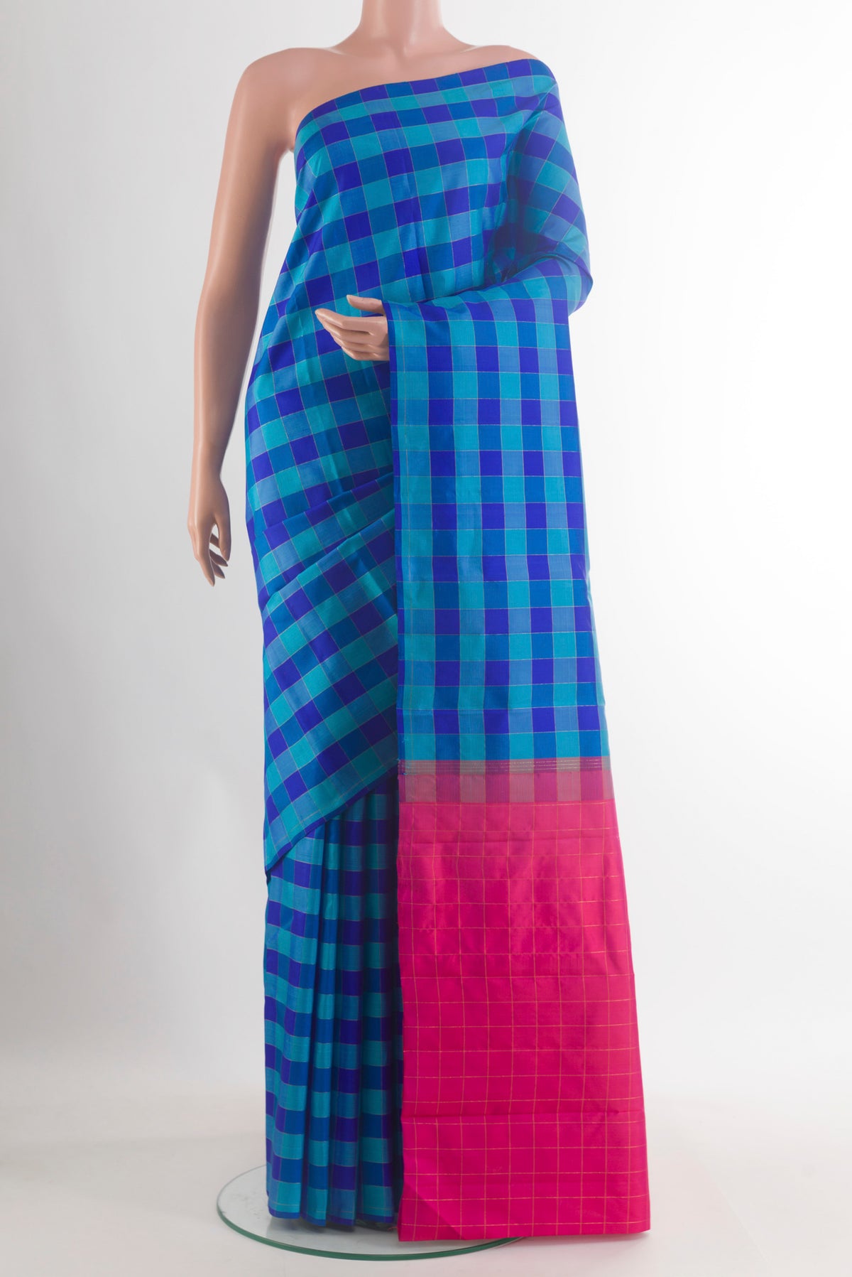 Pure Silk Blue Kanchipuram Saree with Checked design on the body and Without Border.  displayed on a mannequin