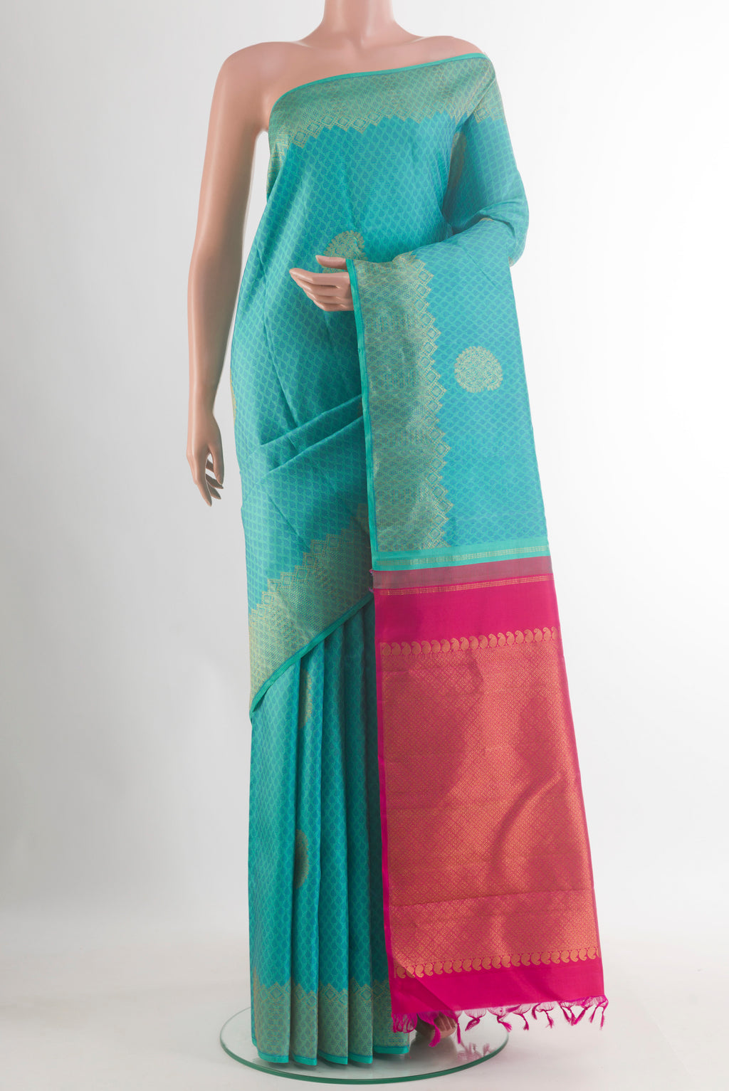 Pure Silk Turquoise Kanchipuram Saree with Jacquard With Zari Butta on the body and Zari Border.  displayed on a mannequin