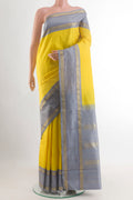 Yellow Kanjivaram Silk Saree with Plain Body and Zari Border.  displayed on a mannequin
