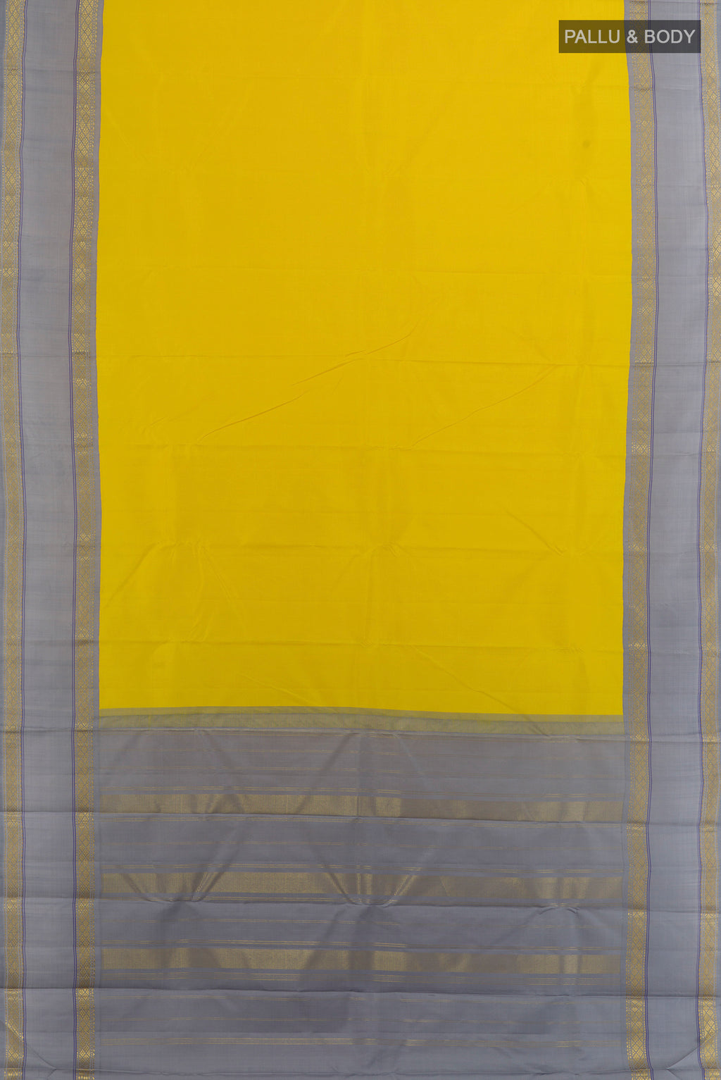 Flat view of Yellow Kanjivaram Silk Saree with Plain Body and Zari Border. 