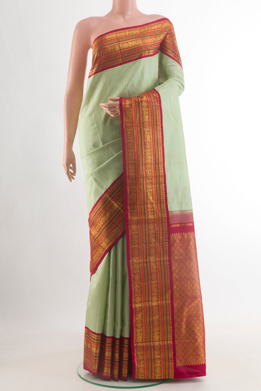 Mint Green Kanjivaram Silk Saree with Plain Body and Zari Border.  displayed on a mannequin