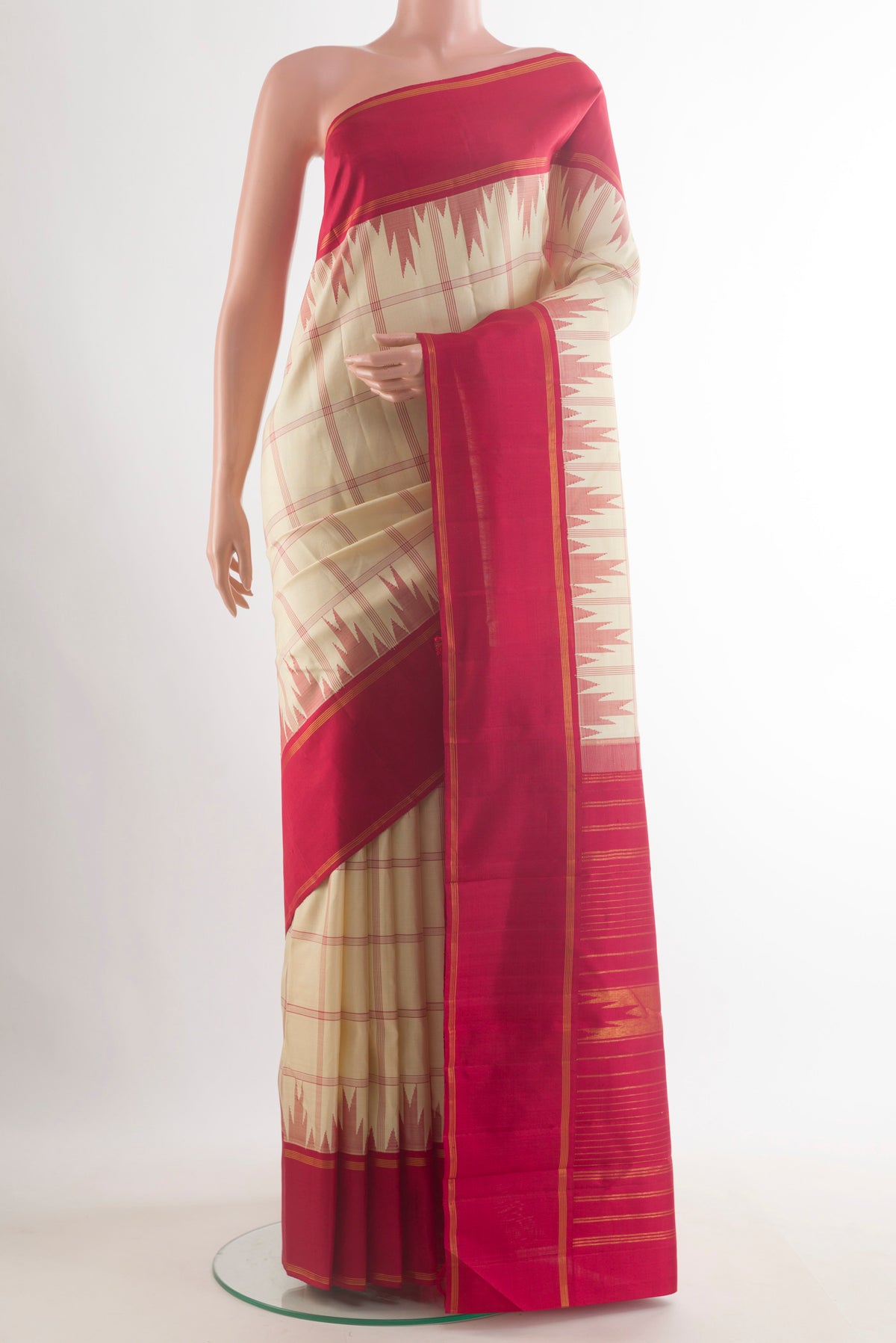 Pure Silk Off White Kanjivaram Saree with Checked design on the body and Temple Border.  displayed on a mannequin